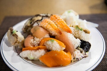 A plate of various kinds of fish sushi at a buffet restaurant, Japanese food
