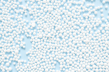 Abstract blue background with scattered white balls top view. Minimal style blank.