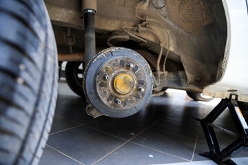 A rear hub of the car after removing a tire and wheel, maintaining a brake and wheel system, car...