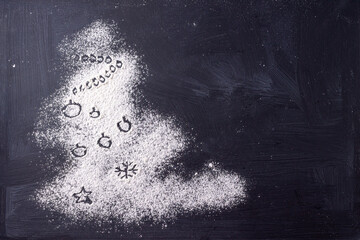 christmas tree made of flour on black background space for text
