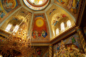 Fototapeta na wymiar POCHAIV, UKRAINE -2021: Lavra Orthodox Christian Monastery Complex Transfiguration Cathedral Interior Cupola Ceiling Fresco of God Jesus Christ