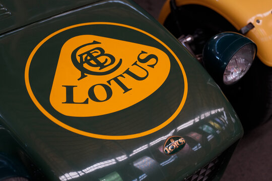 lotus seven yellow and british green racing car close-up detail logo brand and text sign