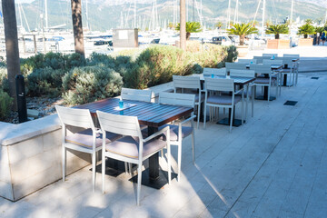 Empty chair and table with outdoor view. Tivat Porto Montenegro

