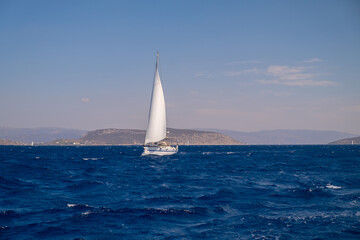 Catamaran sail Yacht cruising on deep blue sea water