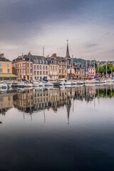 Fototapeta na wymiar Historic center with the canal of the port of the city of Honfleur and its typical houses, located in Normandy, France