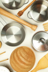 Different kitchen utensil on white background, top view