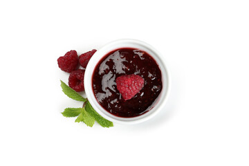 Ceramic bowl of raspberry jam isolated on white background