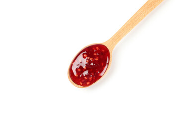 Spoon of raspberry jam isolated on white background