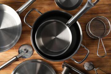 Kitchen utensil on wooden table, top view