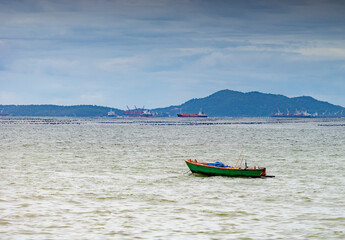 An image landscape view rustic and empty lonely boat in harbor or bay on fisherman with copy space.