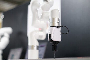 Robot arm automatic drilling machine at industrial production plant