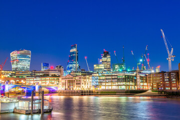 Fototapeta na wymiar London night skyline with river Thames reflections - UK