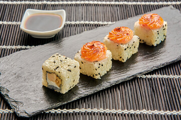 delicious baked crab rolls on a stone stand