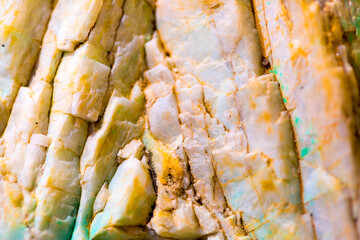 Background from dracocene crystals of stones. Fluorite stone in the rocks of the adit. Mineral stones in their natural environment. Semiprecious stones texture.