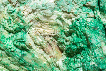 Background from dracocene crystals of stones. Fluorite stone in the rocks of the adit. Mineral stones in their natural environment. Semiprecious stones texture.