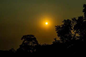 The beautiful sunset over the forest into the village and sundown is one of his most famous moment for everyone