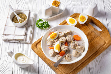 Zurek polish rye soup on a white wooden background