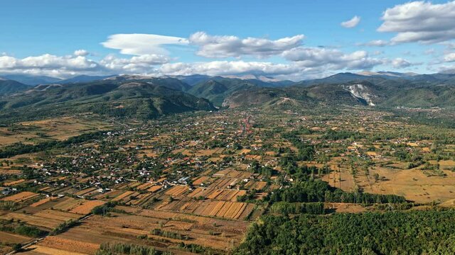 Aerial drone view of nature in Romania. Carpathian mountains, with a Baia de Fier village, greenery