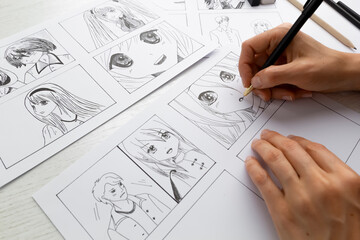 An artist draws a storyboard of an anime comics book. Manga style. - 462570358