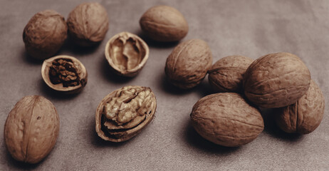 Nuts on old brown wooden table. Food banner concept