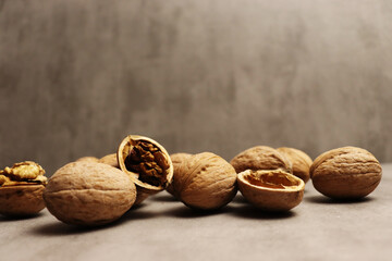 Walnuts on brown wooden table for banner concept