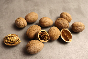 Beautiful food background with tasty nuts on gray table