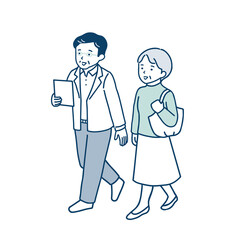 並んで歩くシニア夫婦