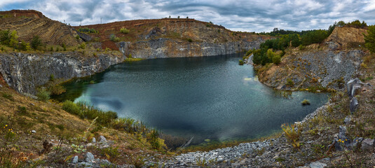 Fototapeta na wymiar Volcanic lake in a rocky landscape