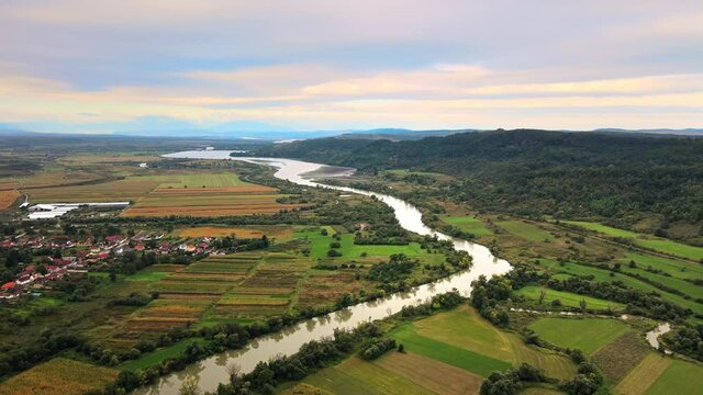 Aerial drone view of Carta, Romania. Country buildings, greenery, river