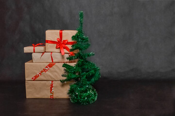 christmas gifts and a Christmas tree on a black background