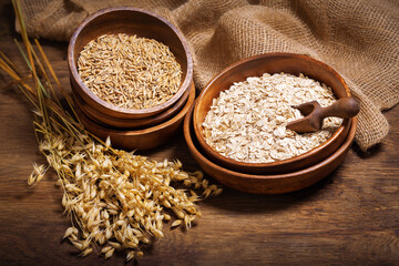 oatmeal flakes, grains and ears of oat