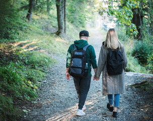 Traveler couple in love enjoying in the forest. Freedom and active lifestyle concept.