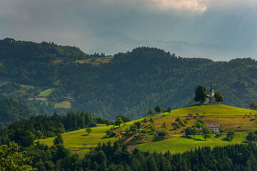 Lonely Church Stand Out on Hilltop in Alpine Landscape. Sveti Tomaz in Slovenia