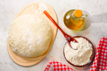 Homemade dough for baking. Wheat flour yeast dough. Cooking for pizza, loaf and rolls
