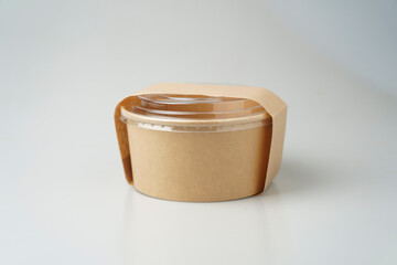 Take away salad box disposable food container craft paper mock up and cover on grey background with copy space. Delivery food concept.