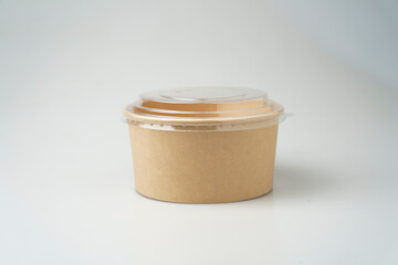 Take away salad box disposable food container craft paper mock up on grey background with copy space. Delivery food concept.