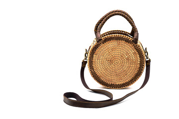 Round wicker rattan handbag, isolated on white. Modern stylish straw bag.
