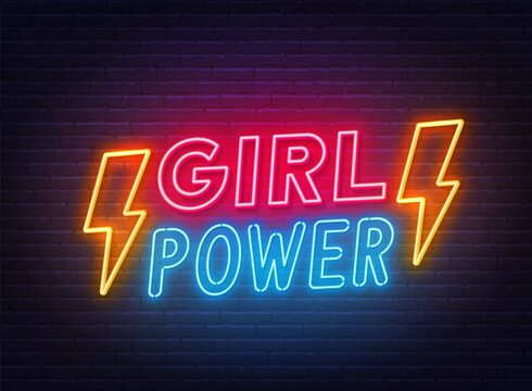 Girl Power neon lettering on brick wall background.