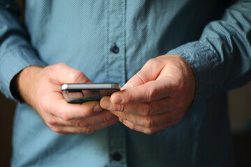 businessman holding mobile phone