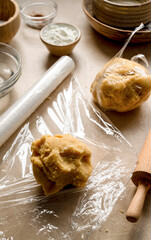 Raw dough wrapped in plasti foil, ready to be cooled in the fridge, cooking a pie, tart or cookies. Step by step recipe.