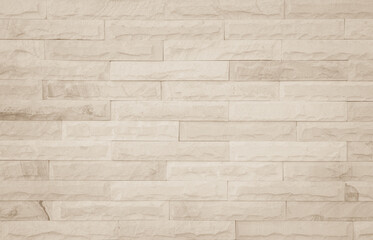 Cream and white brick wall texture background. Brickwork and stonework flooring interior rock old pattern
