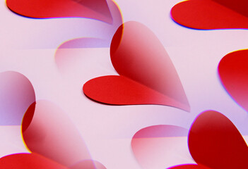 red paper hearts on white background