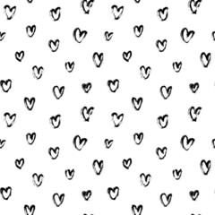 Vector pattern with black hearts. Linear silhouettes of hearts hand-drawn in charcoal. Romantic ink illustration. Black-white seamless pattern for Valentine's Day. Simple repeating chaotic texture.