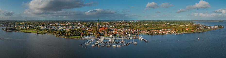 Panorama aerial view of town Schleswig on firth of Schlei, Schleswig-Holsten, Germany.  - obrazy, fototapety, plakaty