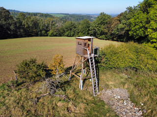 Hunters perch in a field