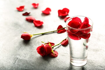 Rose petals infused water on a beautiful background.