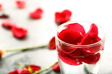 Rose petals infused water on a beautiful background.