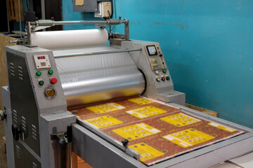 Industrial laminator, lamination of paper products. The manufacture of packaging. Outdated...