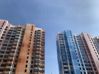 Naklejka premium architecture buildings sky road line pathway walkway day clear blue sky colored buildings houses high-rise buildings industrial