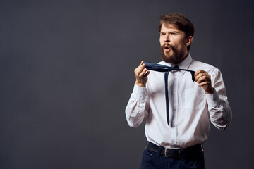 The man in a suit holding a tie executive office isolated background